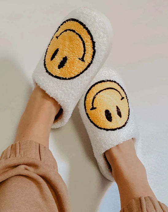 WHITE FUZZY HAPPY FACE SLIPPERS